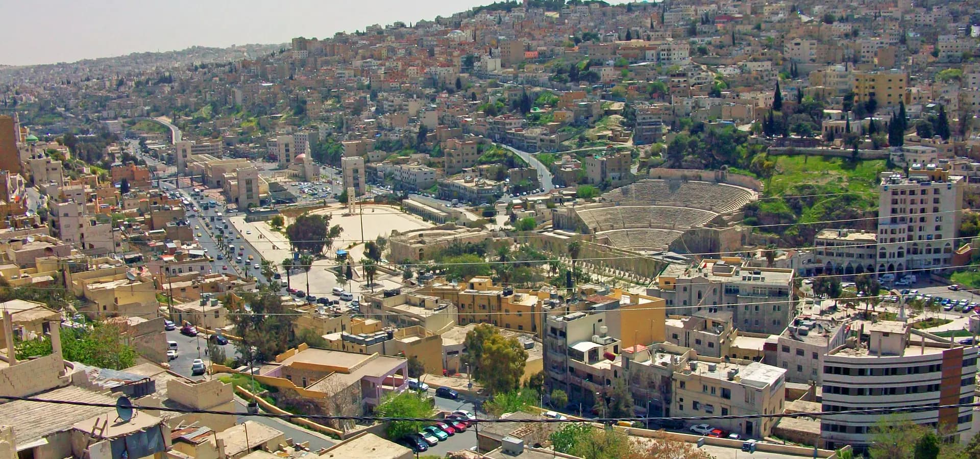 View from Citadel Hill over downtown Amman, the Roman Theater and pale stone houses climbing the surrounding hills